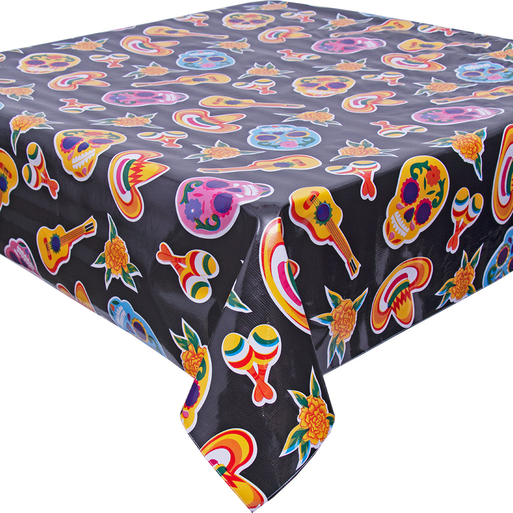 freckled sage skulls on black tablecloth