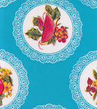 Freckled Sage Oilcloth Swatch Doily on Light blue