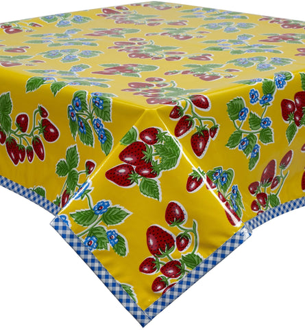 Freckled Sage Oilcloth Tablecloth Strawberries on Yellow background with blue gingham trim