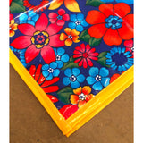 corner of betty's bunch navy blue oilcloth tablecloth with solid yellow trim