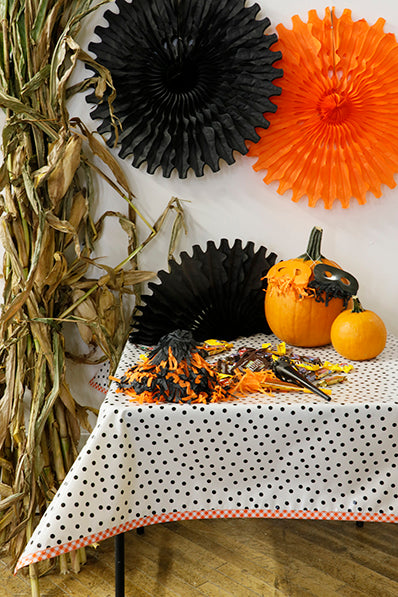 Freckled Sage oilcloth tablecloth black dots on solid white with orange gingham trim set in fall halloween display pumpkins party favors corn stalks