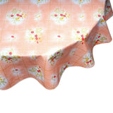 round bows and bouquet salmon oilcloth tablecloth close up