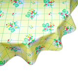 round bows and bouquet yellow oilcloth tablecloth close up
