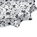 round chelsea on black oilcloth tablecloth close up