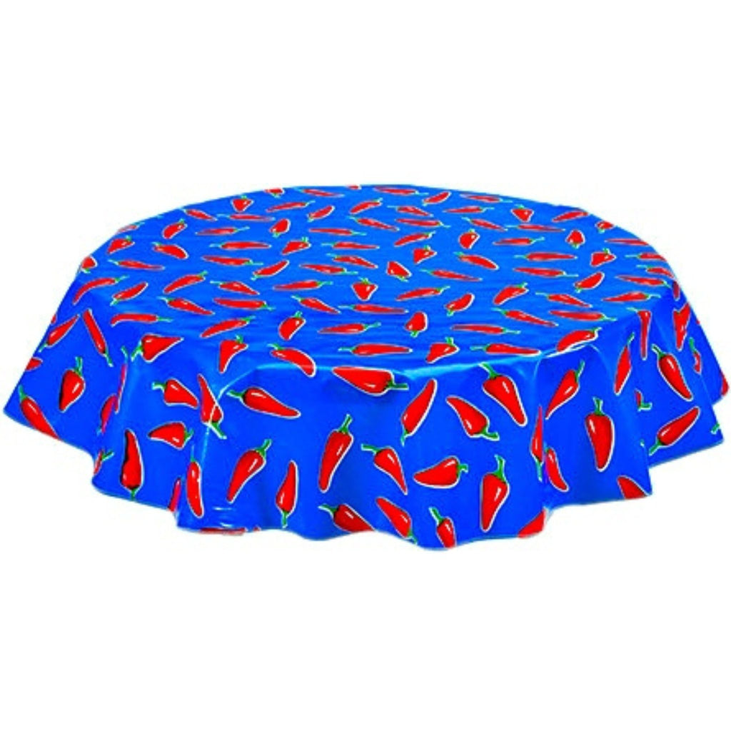 round chili peppers on blue oilcloth tablecloth