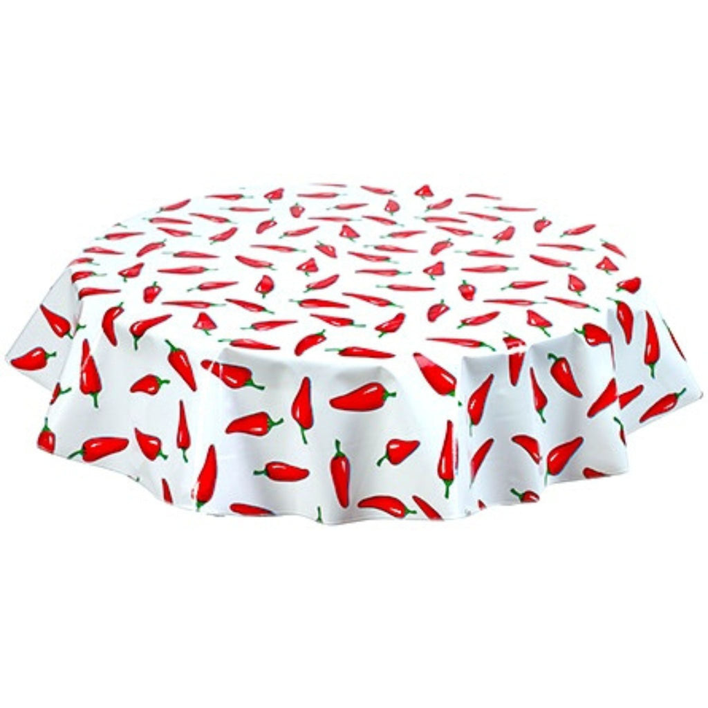 round chili peppers on white oilcloth tablecloth