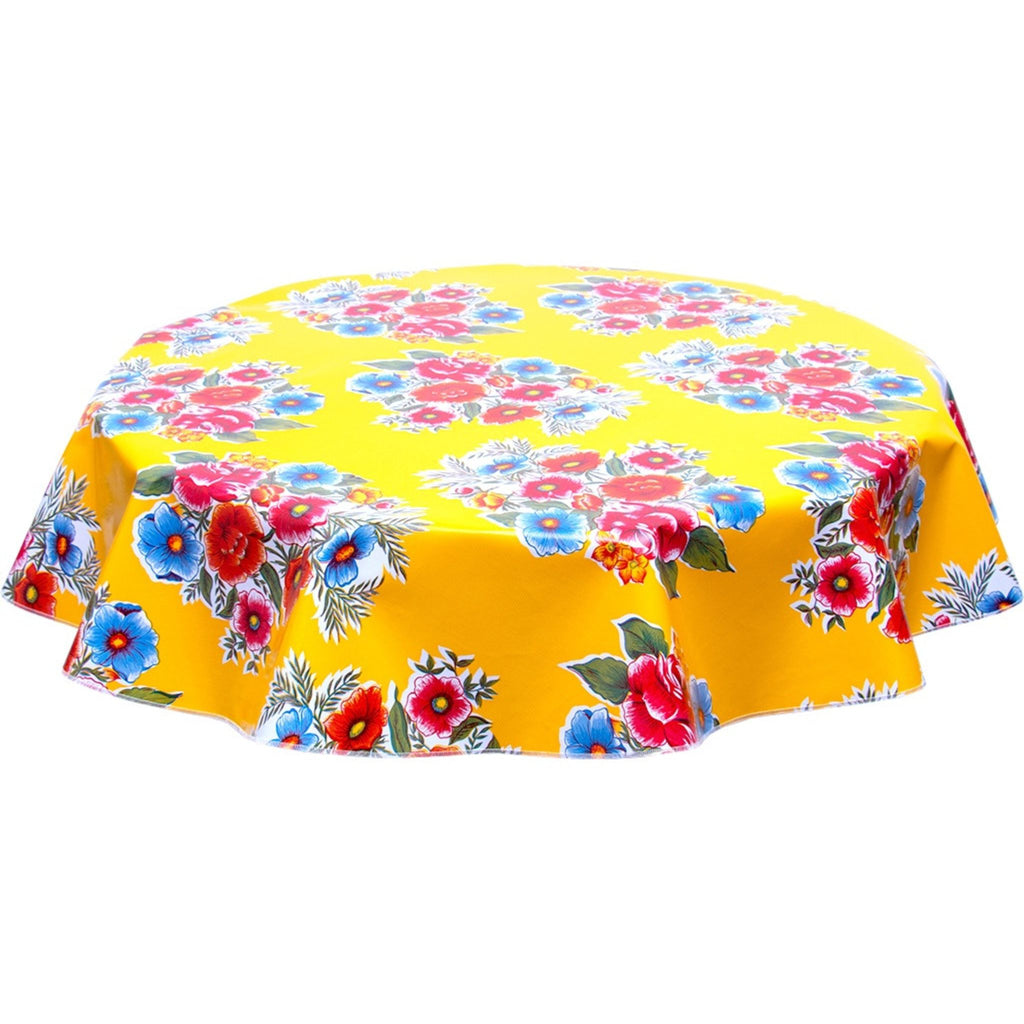 round flowers on yellow oilcloth tablecloth