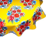round flowers on yellow oilcloth tablecloth