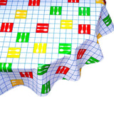 round forks and spoons blue oilcloth tablecloth close up