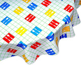 round forks and spoons lime green oilcloth tablecloth close up