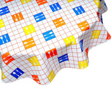 round forks and spoons red oilcloth tablecloth close up