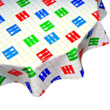 round forks and spoons yellow oilcloth tablecloth close up