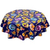 freckled sage round skulls on navy blue oilcloth tablecloth