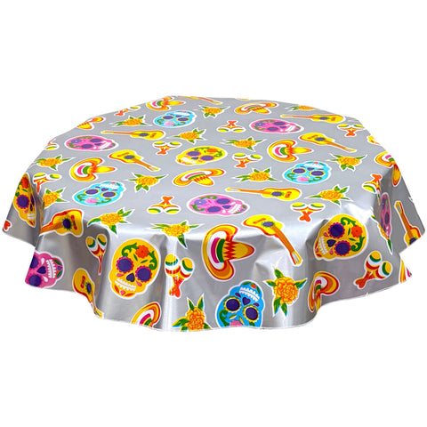 freckled sage round skulls on silver oilcloth tablecloth