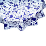 round chelsea flowers on navy blue oilcloth tablecloth close up
