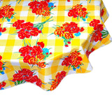 round gingham and flowers yellow oilcloth tablecloth close up