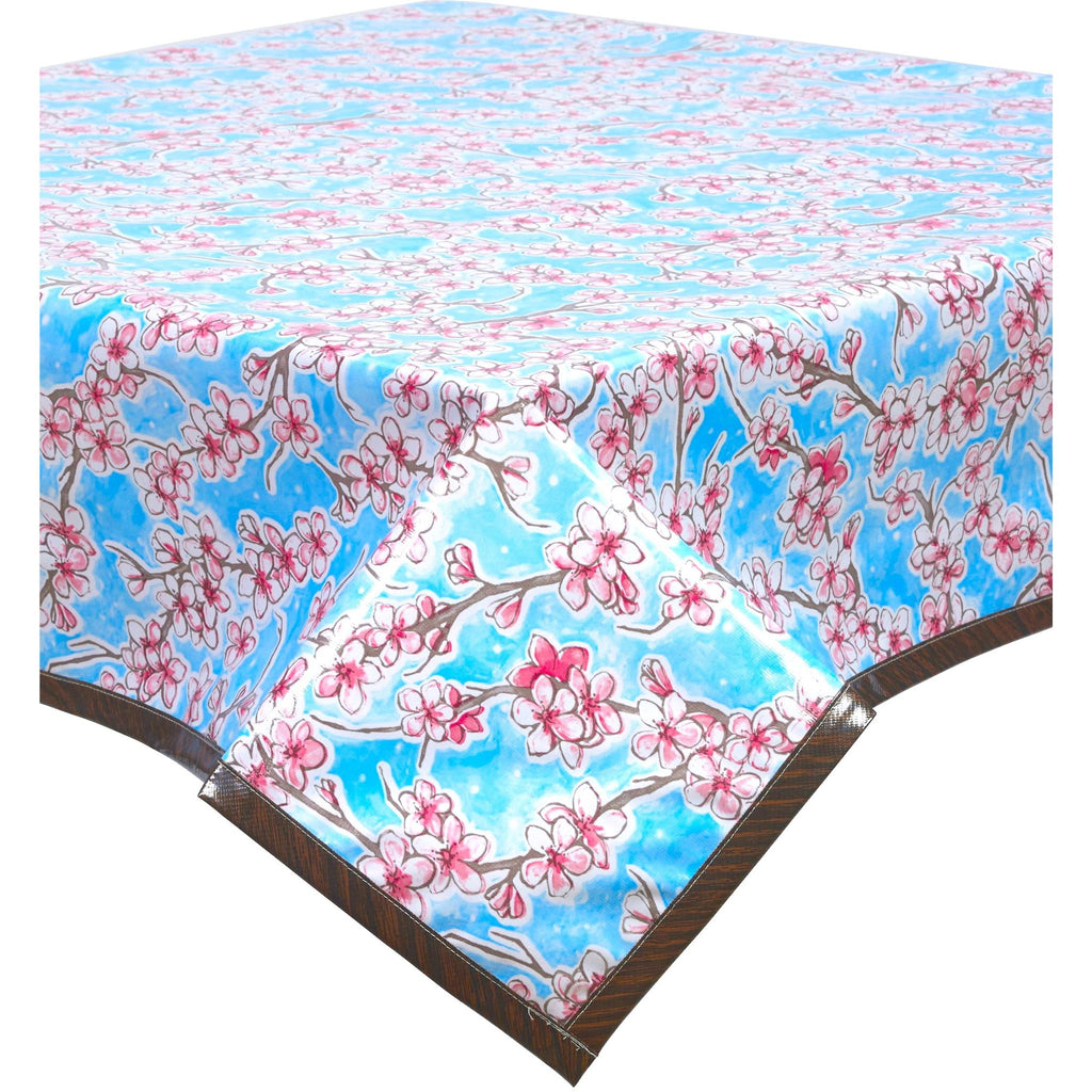 cherry blossom light blue oilcloth tablecloth with faux bois trim