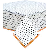 square dot black oilcloth tablecloth with orange gingham trim