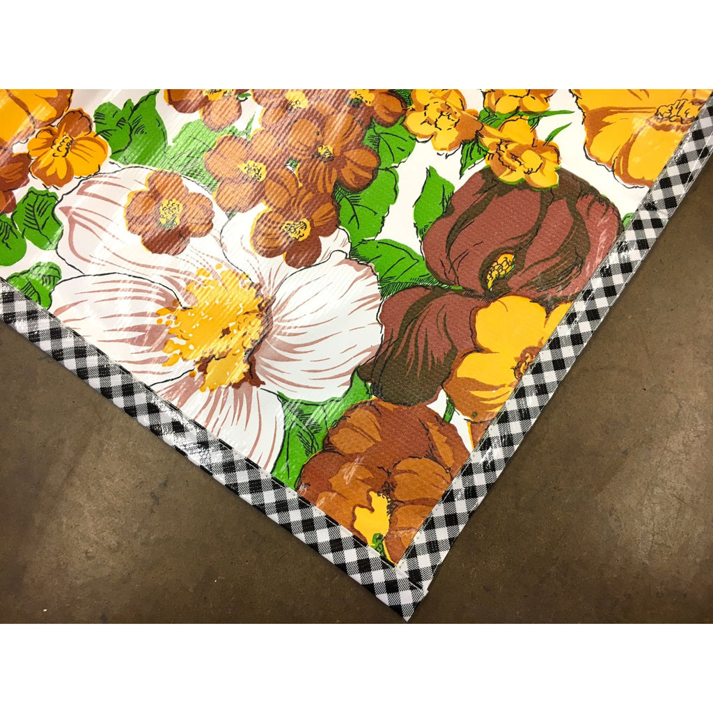 garden yellow oilcloth tablecloth with black gingham trim