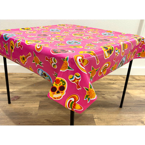skulls on pink oilcloth tablecloth with a simple hem