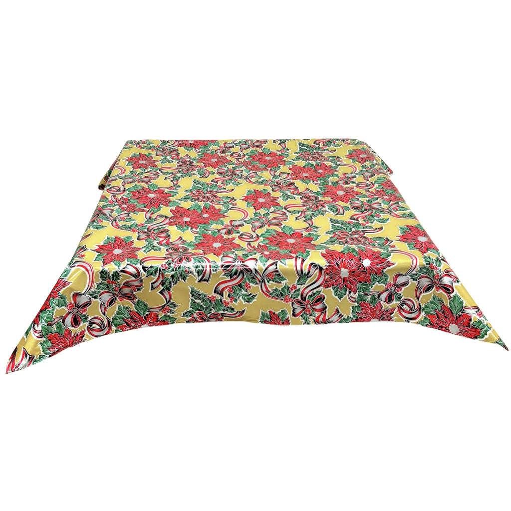 freckled sage christmas ribbons and holly gold oilcloth tablecloth with a simple hem