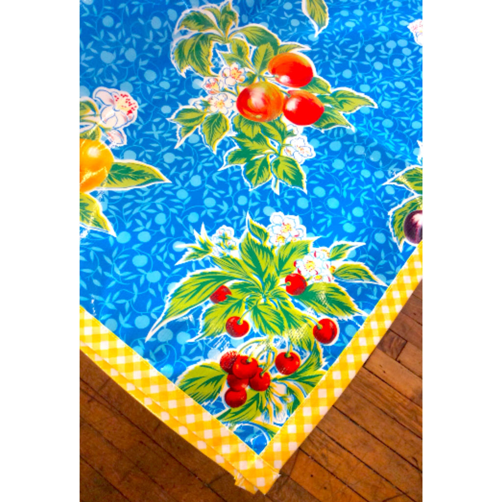 plum blue oilcloth tablecloth with yellow gingham trim