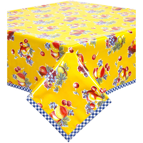 retro yellow oilcloth tablecloth with navy blue gingham trim