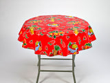 freckled sage fruit basket on red round tablecloth
