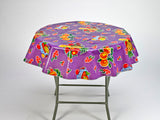 freckled sage fruit basket on purple round tablecloth