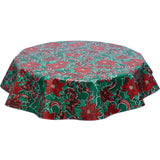 Christmas ribbons and Holly on Green tablecloth