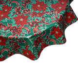 round tablecloth Christmas ribbons and holly on green