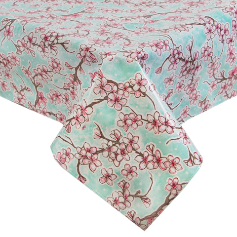 Freckled Sage Oilcloth Tablecloth Cherry Blossoms on Aqua background