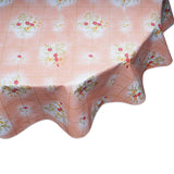 round oilcloth tablecloth bows and bouquet on salmon