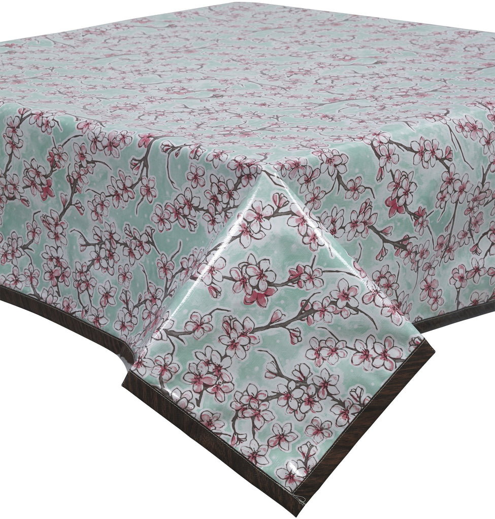 Freckled Sage Oilcloth Tablecloth Cherry Blossoms on  solid Aqua with faux bois trim